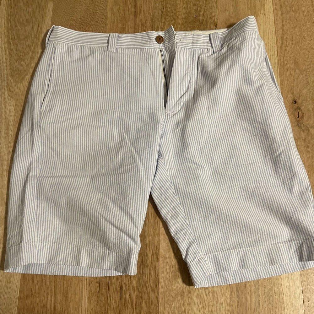 J Crew shorts white with blue stripe and brown buttons.